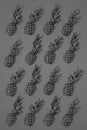 Isolated pineapples pattern on bright vivid turquoise background, low key monochrome.
