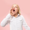 Isolated on pink young casual teen girl shouting at studio Royalty Free Stock Photo