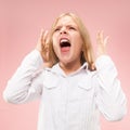 Isolated on pink young casual teen girl shouting at studio Royalty Free Stock Photo