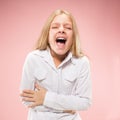 Isolated on pink young casual teen girl shouting at studio Royalty Free Stock Photo