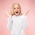 Isolated on pink young casual teen girl shouting at studio Royalty Free Stock Photo