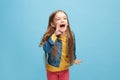 Isolated on pink young casual teen girl shouting at studio Royalty Free Stock Photo