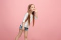 Isolated on pink young casual teen girl shouting at studio Royalty Free Stock Photo