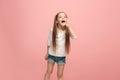 Isolated on pink young casual teen girl shouting at studio Royalty Free Stock Photo