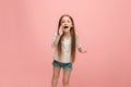 Isolated on pink young casual teen girl shouting at studio Royalty Free Stock Photo