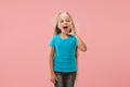 Isolated on pink young casual teen girl shouting at studio Royalty Free Stock Photo