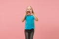 Isolated on pink young casual teen girl shouting at studio Royalty Free Stock Photo