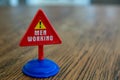 Isolated plastic toy warning sign - Men Working. Men at work, danger ahead, do not enter, forbidden, construction sight, Royalty Free Stock Photo