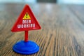 Isolated plastic toy warning sign - Men Working. Men at work, danger ahead, do not enter, forbidden, construction sight, Royalty Free Stock Photo