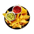 Isolated plate of nachos, salsa and guacamole