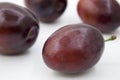 Isolated plums. Whole and a half of blue plum fruit isolated on white background, with clipping path, Royalty Free Stock Photo