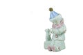 Isolated porcelain figurine sad clown.