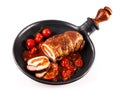 Isolated pork roast and tomatoes top view Royalty Free Stock Photo
