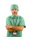 Isolated portrait of attractive and handsome medicine doctor or hospital nurse man in surgical bouffant hat and medical scrub Royalty Free Stock Photo