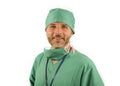 Isolated portrait of attractive and handsome medicine doctor or hospital nurse man in surgical bouffant hat and medical scrub