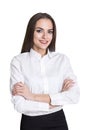 Isolated portrait of a smiling businesswoman standing with her arms crossed and looking at the viewer with confidence. Royalty Free Stock Photo