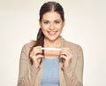 Isolated portrait of smiling young woman holding pregnant test.