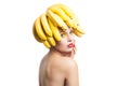 Isolated portrait of topless model with bananas on head Royalty Free Stock Photo