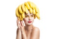 Isolated portrait of topless model with bananas on head Royalty Free Stock Photo
