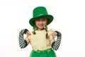 Isolated portrait on white background of adorable lovely little child girl, dressed for a party of Saint Patrick& x27;s