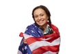 Isolated portrait on white background of charming ethnic middle-aged woman, smiling at camera, wrapped in USA flag