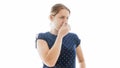 Isolated portrait of young woman closing her nose because of bad smell Royalty Free Stock Photo