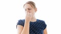 Isolated portrait of young woman feeling bad smell closing her nose Royalty Free Stock Photo