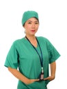 Isolated portrait of young beautiful and happy Asian Chinese medicine doctor woman or hospital nurse in medical hat and scrub Royalty Free Stock Photo