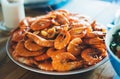 Isolated prepared orange shrimp on background table on home kitchen, closeup of fresh prawn products, shellfish sea food on plate Royalty Free Stock Photo