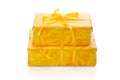 Isolated presents wrapped in yellow patterned paper