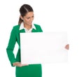 Isolated professional businesswoman in green holding white sign Royalty Free Stock Photo