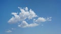 Isolated puffy clouds and blue sky for background use or sky substitution