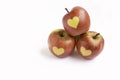 Isolated red apples with shape of heart on a white background Royalty Free Stock Photo
