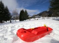 Isolated red bob to play in the snow Royalty Free Stock Photo