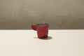 Isolated red coffee cup on a white table Royalty Free Stock Photo