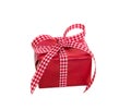 Isolated red gift box with a checked ribbon on a white background Royalty Free Stock Photo