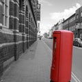 Isolated Red Post Box on Black and White Street in Birmingham Royalty Free Stock Photo