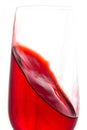 isolated of red water in wine glass is motion on white background Royalty Free Stock Photo