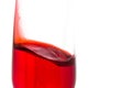 isolated of red water in wine glass is motion on white background Royalty Free Stock Photo