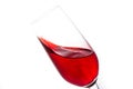 isolated of red water in wine glass is motion on white background Royalty Free Stock Photo