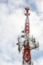 Isolated red and white telecommunication antenna tower