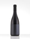 Isolated Red Wine Bottle in a White Background, White Black Label Royalty Free Stock Photo