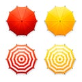 Isolated red and yellow beach umbrellas, top view Royalty Free Stock Photo