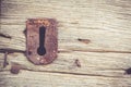 Isolated rusty keyhole on old wooden door Royalty Free Stock Photo