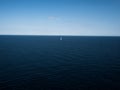 Isolated sailing boat ship yacht on deep blue open water mediterranean sea ocean Mallorca Balearic Islands Spain Royalty Free Stock Photo