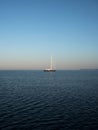 Isolated sailing boat ship yacht on deep blue open water mediterranean sea ocean Mallorca Balearic Islands Spain Royalty Free Stock Photo