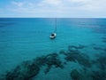 Isolated sailing boat ship yacht on turquoise blue open water mediterranean sea ocean Mallorca Balearic Islands Spain Royalty Free Stock Photo