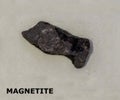 Isolated sample of a Magnetite rock on texture background. Magnetite Igneous Rock sample. Magnetite stone isolated Royalty Free Stock Photo