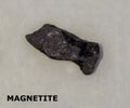 Isolated sample of a Magnetite rock on texture background. Magnetite Igneous Rock sample. Magnetite stone isolated Royalty Free Stock Photo
