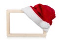 Santa hat and blank frame isolated on background Royalty Free Stock Photo